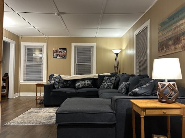 living room with baseboards and wood finished floors