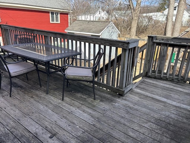 wooden deck featuring outdoor dining space