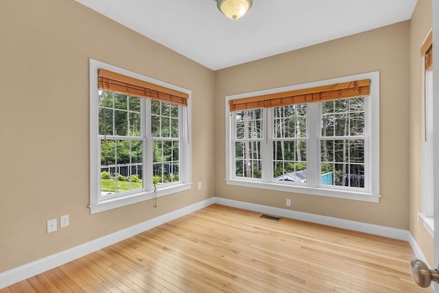 52 Sylvan Dr, Stow, MA 01775 - empty room featuring plenty of natural light and light wood finished floors