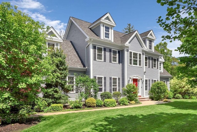 52 Sylvan Dr, Stow, MA 01775 - view of front of home featuring a front yard and a shingled roof