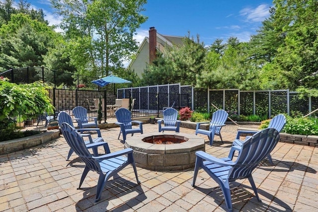52 Sylvan Dr, Stow, MA 01775 - view of patio featuring a fire pit