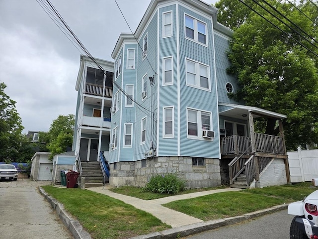 133 Mount Vernon St, Lowell, MA 01854 - view of front facade with stairs and an outdoor structure