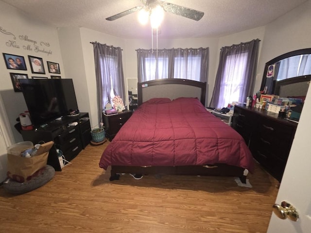 133 Mount Vernon St, Lowell, MA 01854 - bedroom featuring wood finished floors, a textured ceiling, and ceiling fan