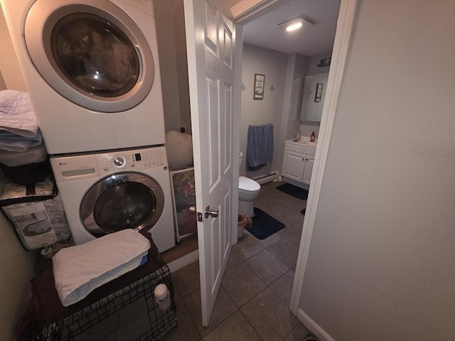 133 Mount Vernon St, Lowell, MA 01854 - washroom featuring stacked washer / dryer and tile patterned flooring