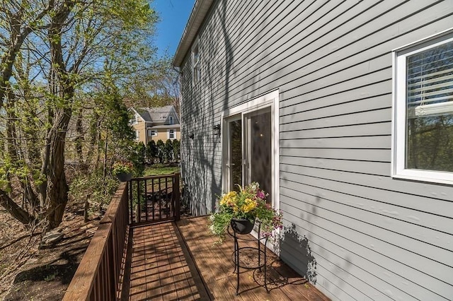 view of side of property featuring a deck