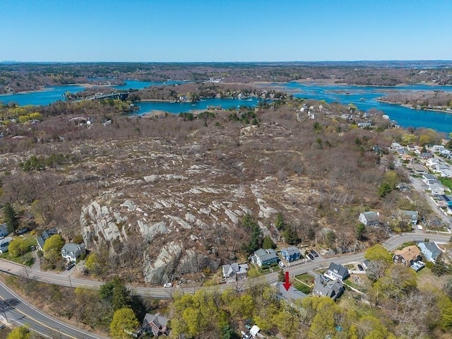 drone / aerial view featuring a residential view and a water view