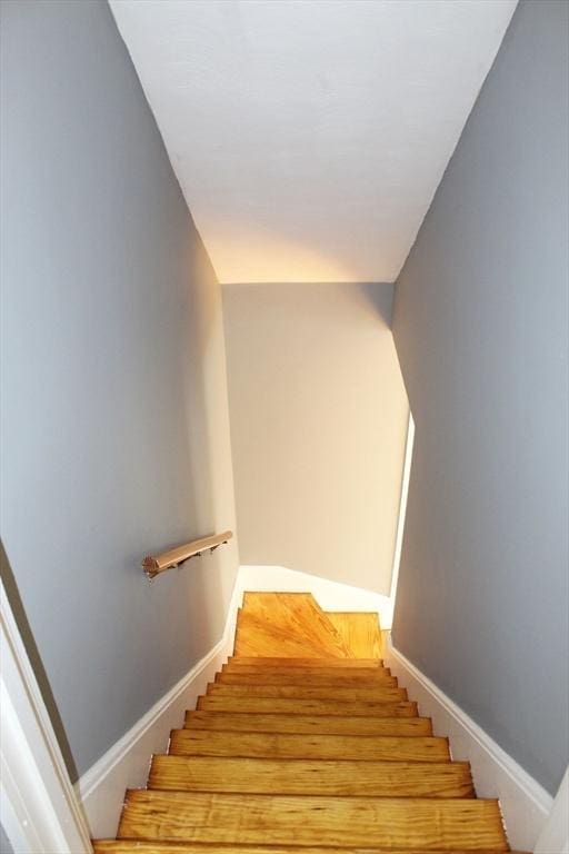stairway featuring baseboards