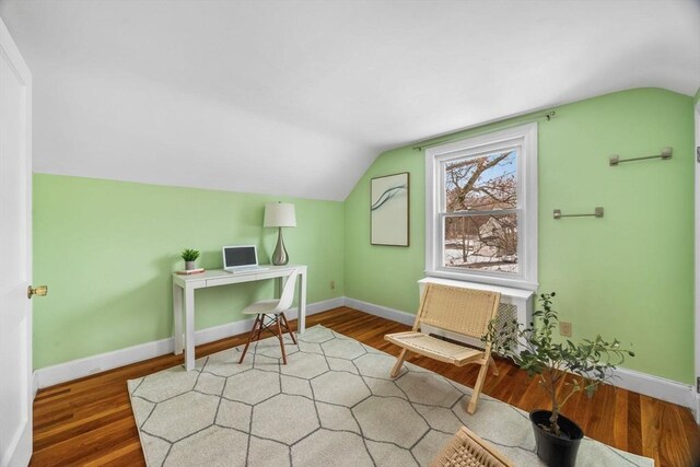 office area featuring lofted ceiling and hardwood / wood-style floors