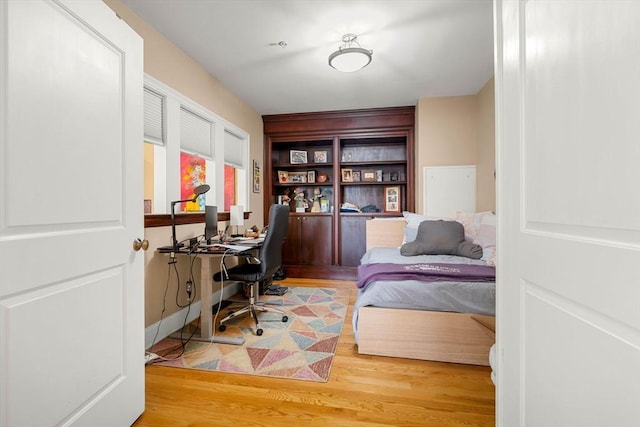 bedroom featuring wood finished floors