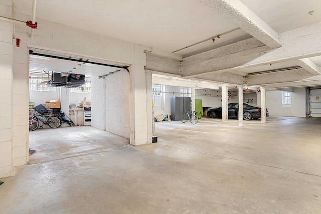 parking garage featuring concrete block wall