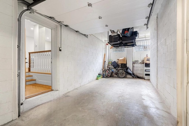 garage with concrete block wall