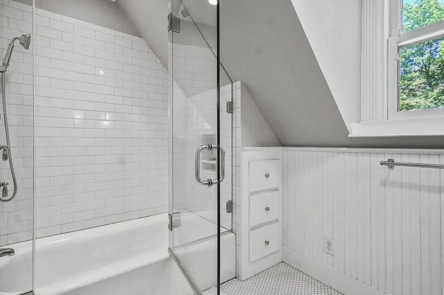 47 Stetson, Haverhill, MA 01835 - full bathroom with lofted ceiling, bath / shower combo with glass door, tile patterned floors, and wainscoting