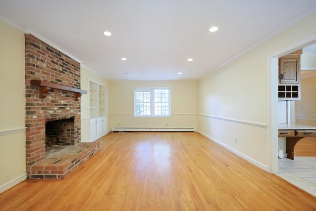 unfurnished living room featuring crown molding, built in features, a baseboard heating unit, a fireplace, and light wood-type flooring