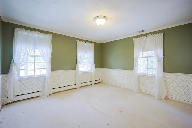 empty room featuring light carpet, crown molding, a wealth of natural light, and a baseboard radiator