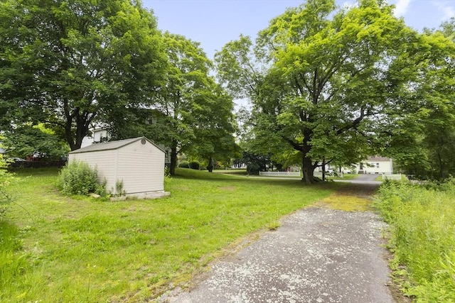 35-R Whiting St, North Attleboro, MA 02760 - view of grassy yard featuring a shed