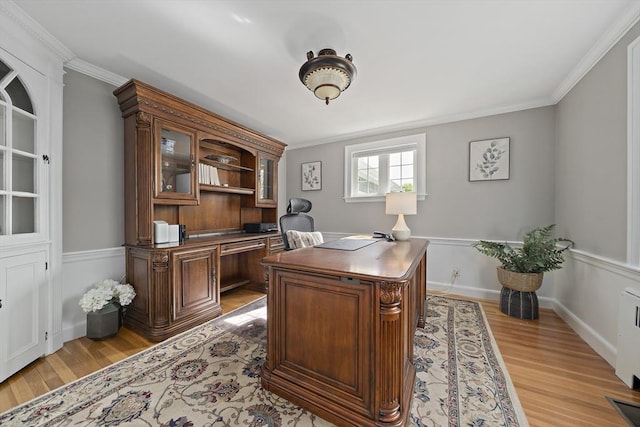 office area featuring light wood-style floors and ornamental molding