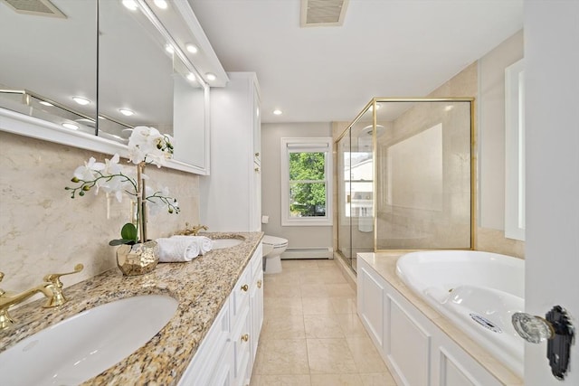 full bath featuring visible vents, a sink, a baseboard heating unit, and a stall shower