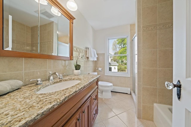 bathroom featuring an enclosed shower, tile walls, vanity, tile patterned floors, and toilet