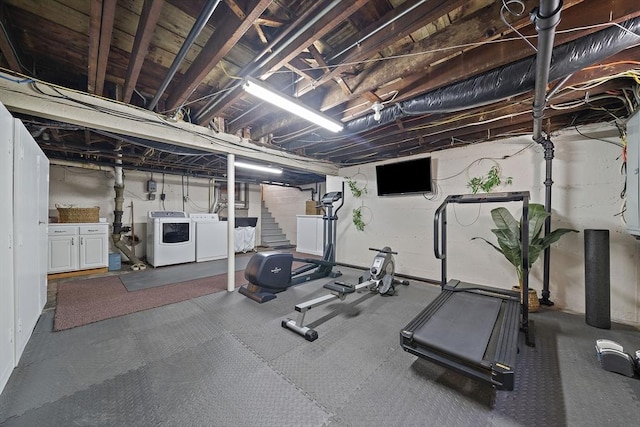workout area with separate washer and dryer