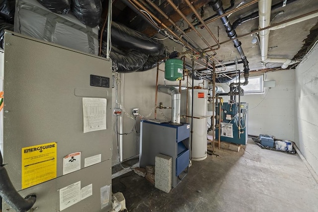 utility room featuring a heating unit, heating unit, and water heater