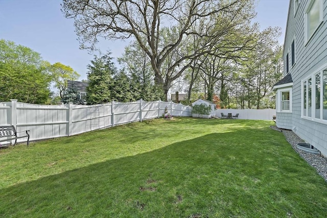view of yard with a fenced backyard