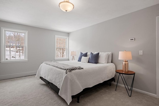 bedroom with baseboards and carpet floors