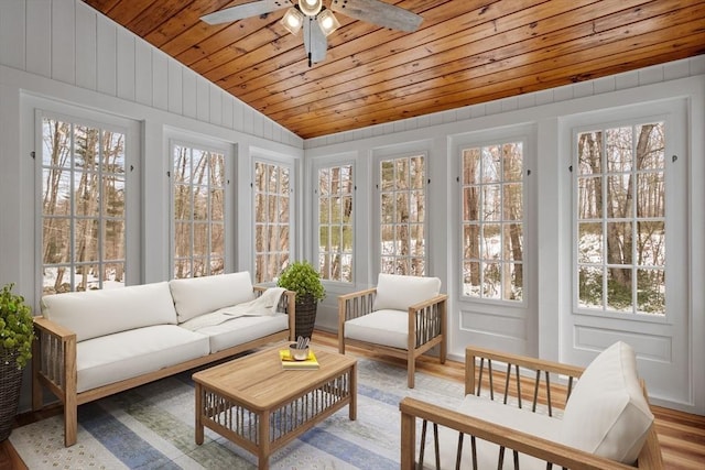 sunroom with a ceiling fan, lofted ceiling, and wood ceiling