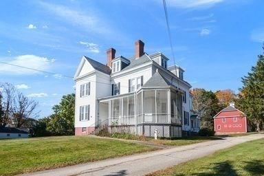 32 Mount Pleasant St, North Brookfield, MA 01535 - view of property exterior featuring a chimney, a sunroom, and a lawn