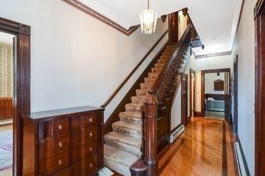 32 Mount Pleasant St, North Brookfield, MA 01535 - stairway with ornamental molding and wood finished floors