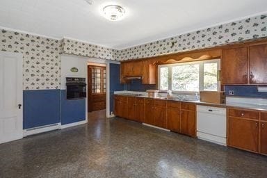 kitchen featuring dishwasher and oven