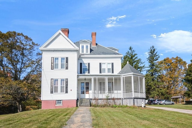 32 Mount Pleasant St, North Brookfield, MA 01535 - view of front of property with a sunroom, a chimney, a shingled roof, and a front lawn
