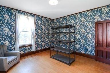 32 Mount Pleasant St, North Brookfield, MA 01535 - interior space with a healthy amount of sunlight, baseboards, wallpapered walls, and wood finished floors