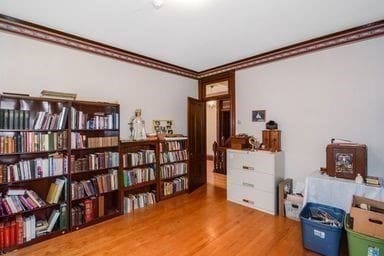 misc room with crown molding and wood-type flooring