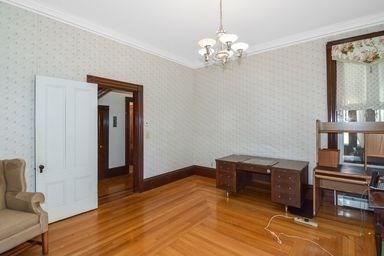 32 Mount Pleasant St, North Brookfield, MA 01535 - dining area featuring baseboards, wallpapered walls, a chandelier, crown molding, and parquet floors