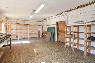 32 Mount Pleasant St, North Brookfield, MA 01535 - interior space featuring brick patterned floor and a garage