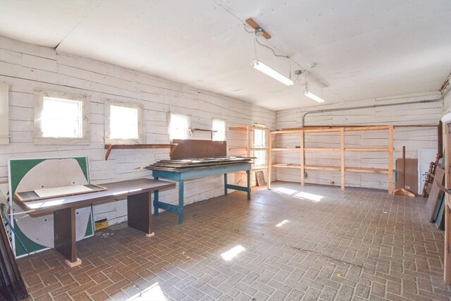 32 Mount Pleasant St, North Brookfield, MA 01535 - misc room featuring wooden walls and brick patterned floor