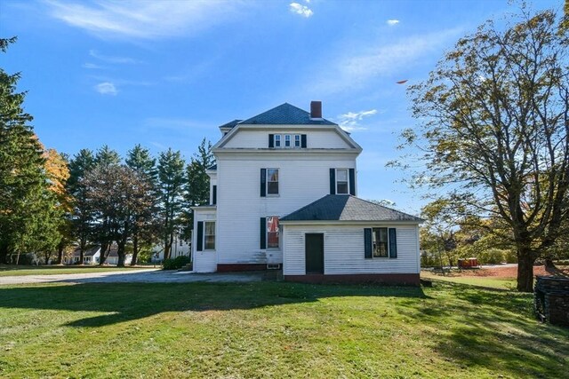 32 Mount Pleasant St, North Brookfield, MA 01535 - back of property featuring a chimney and a lawn