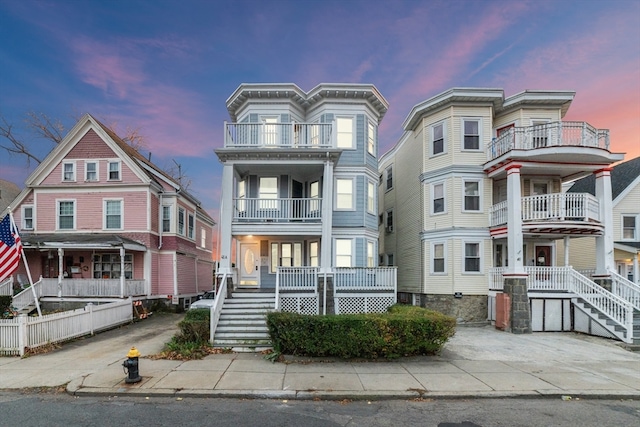 view of front of home featuring a balcony