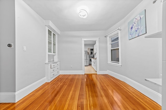 unfurnished room with light hardwood / wood-style floors