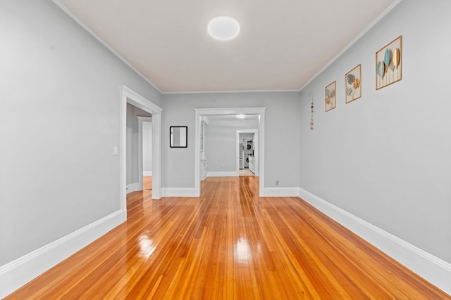 interior space featuring light hardwood / wood-style floors and crown molding