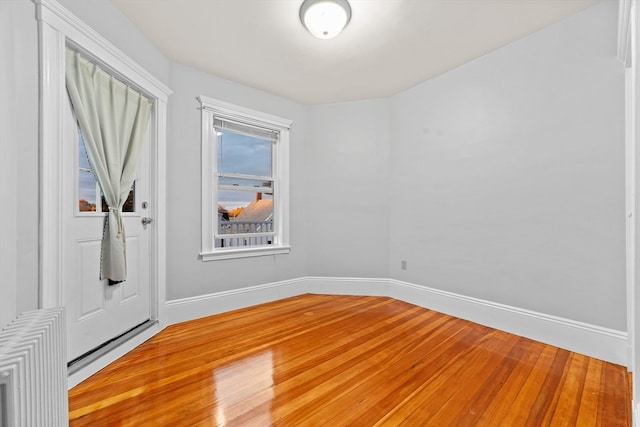 unfurnished room featuring hardwood / wood-style floors