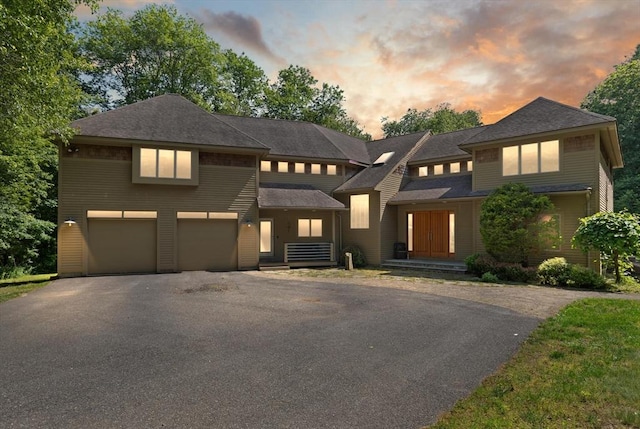 28 Elm St, Berkley, MA 02779 - view of front of home with asphalt driveway, a garage, and roof with shingles