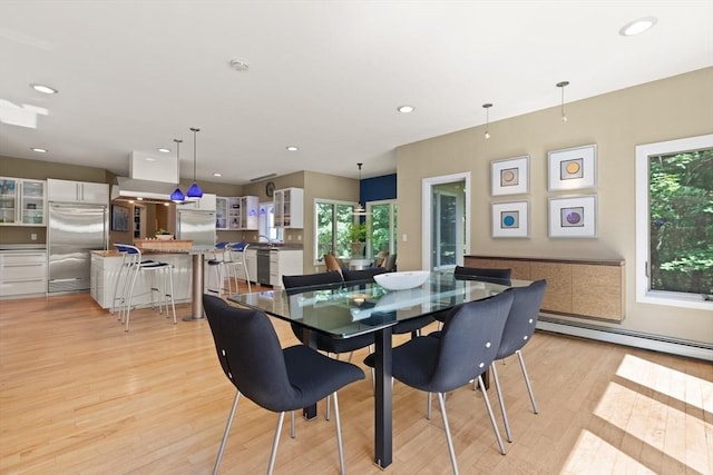 28 Elm St, Berkley, MA 02779 - dining area with a baseboard heating unit, light wood-style floors, plenty of natural light, and recessed lighting