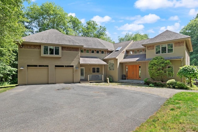 28 Elm St, Berkley, MA 02779 - view of front facade featuring asphalt driveway, an attached garage, and a shingled roof