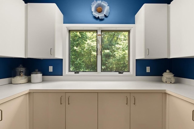 28 Elm St, Berkley, MA 02779 - kitchen with light countertops, healthy amount of natural light, and white cabinetry