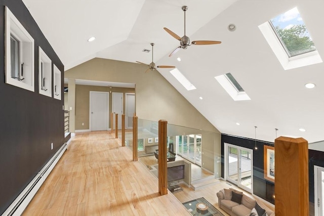 28 Elm St, Berkley, MA 02779 - corridor with a skylight, baseboard heating, healthy amount of natural light, high vaulted ceiling, and recessed lighting