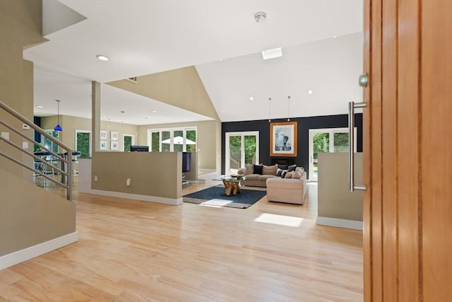 28 Elm St, Berkley, MA 02779 - living area featuring light wood finished floors, stairway, and recessed lighting