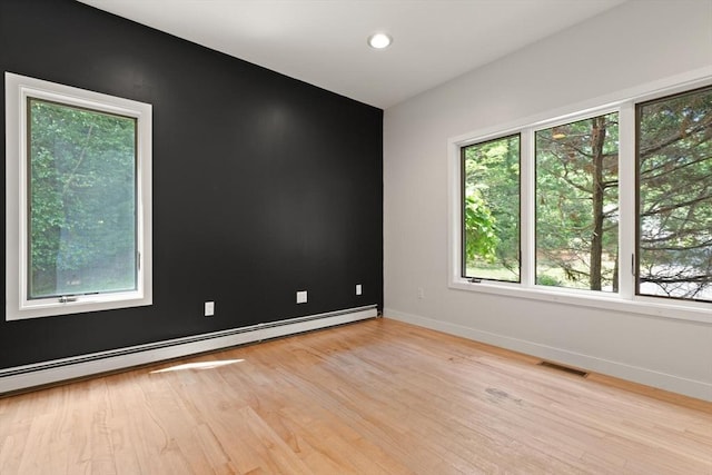28 Elm St, Berkley, MA 02779 - spare room featuring a baseboard radiator, light wood-type flooring, and recessed lighting