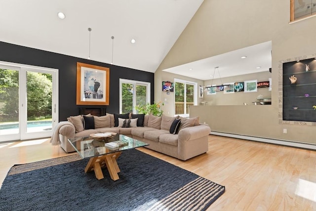 28 Elm St, Berkley, MA 02779 - living room featuring baseboard heating, wood finished floors, high vaulted ceiling, and recessed lighting