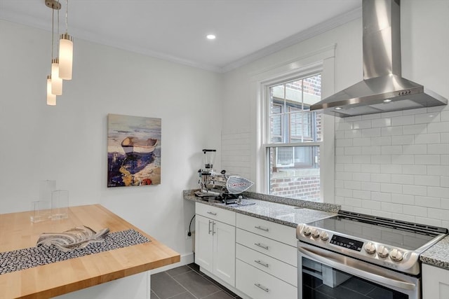 137 Freeman St Unit 3A, Brookline, MA 02446 - kitchen with electric range, wall chimney range hood, crown molding, backsplash, and white cabinets